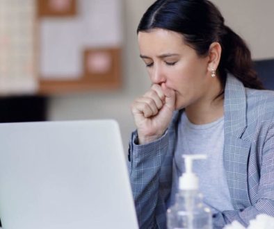 woman coughing air quality testing