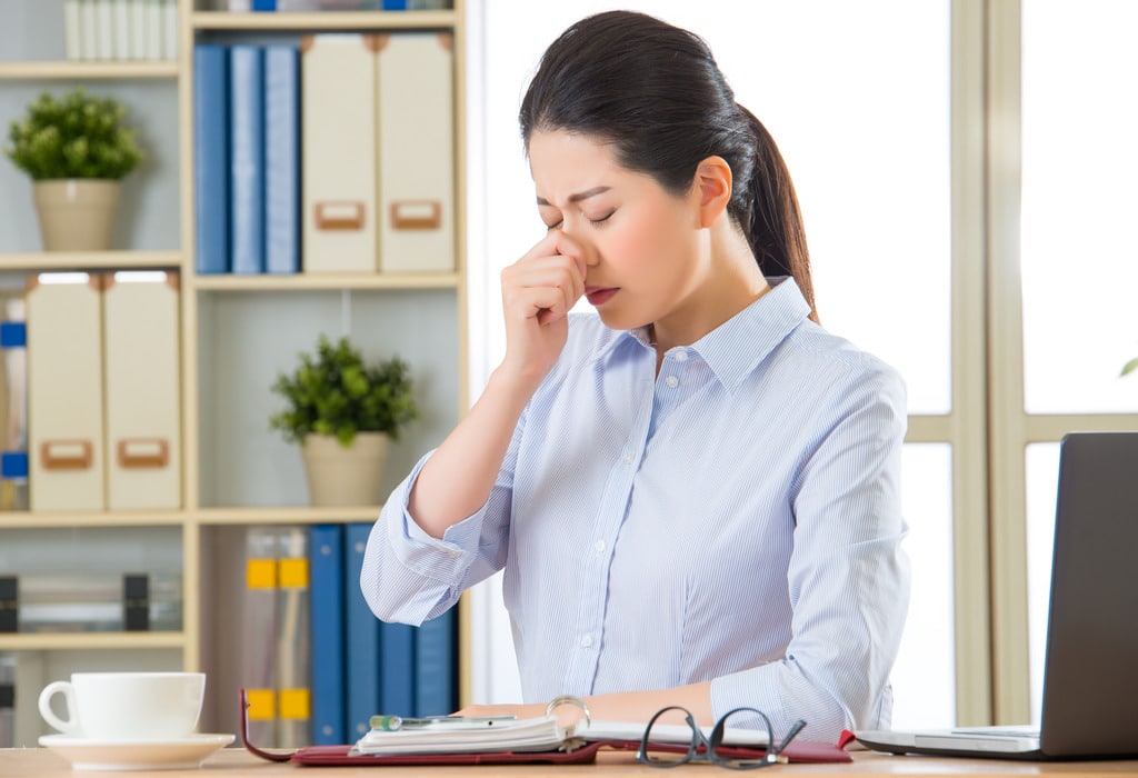 Sick Office Worker Who Needs to Get Your Business Ready for Flu Season