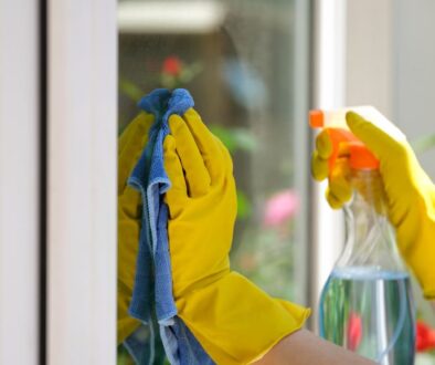 A Closeup of Gloved Hands Reveals How Our Services Can Help With Your Spring Cleaning