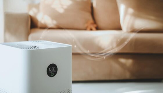 Closeup of an Air Purifier on a Living Room Floor With a Visual of Air Flowing Through It Do Air Purifiers Help With Mold